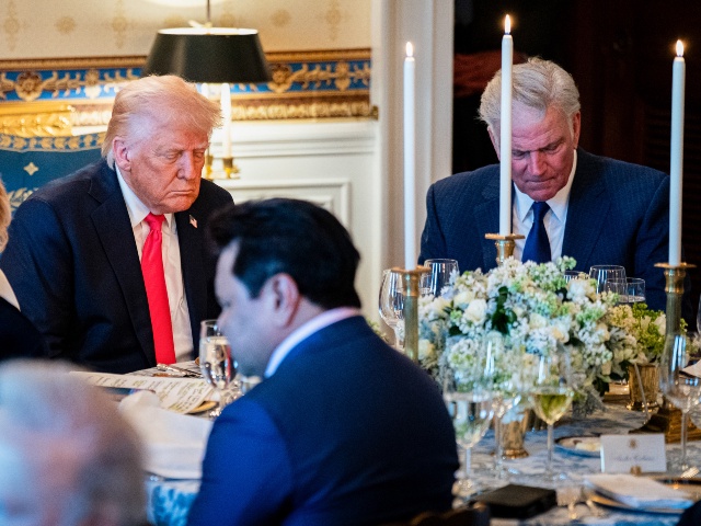 US President Donald Trump bows his head during a prayer at an Easter prayer service and dinner in the Blue Room of the White House in Washington, DC, US, on Wednesday, April 16, 2025. Trump said negotiators made "big progress" in a meeting with Japanese officials seeking a deal to avoid higher levies he has threatened against US trading partners. (Al Drago/Bloomberg via Getty)