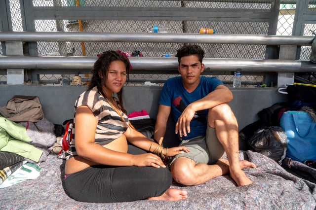 Cuban migrants Dianys Dominguez Aguila, 21, and her boyfriend Andisley Gutierrez Fernandez, 28, have been waiting on the Paso Del Norte Bridge for days, seeking asylum on November 4, 2018 in El Paso, Texas.