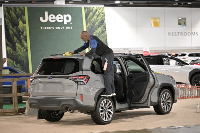 Gerald Johnson makes a Subaru SUV shine for Colorado Auto Show at Colorado Convention Center in Denver on Wednesday, April 16, 2025. (Photo by Hyoung Chang/The Denver Post)