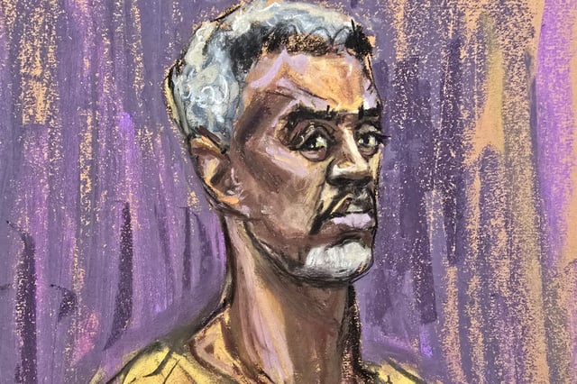 Sean "Diddy" Combs stands during his hearing, where he pleaded not guilty to an expanded federal indictment charging the hip-hop mogul with five criminal counts, including racketeering and sex trafficking, in New York April 14, 2025, in this courtroom sketch.