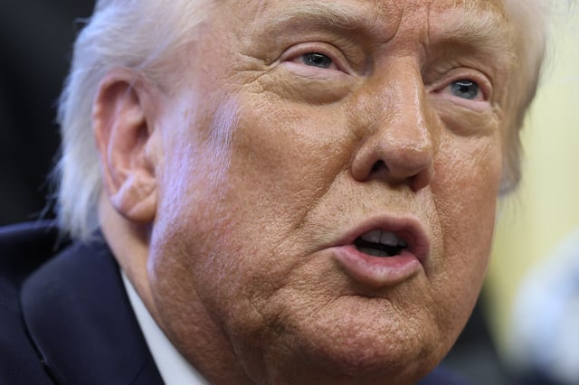 President Donald Trump speaks to reporters after signing a proclamation in the Oval Office at the White House on April 17, 2025 in Washington, DC.