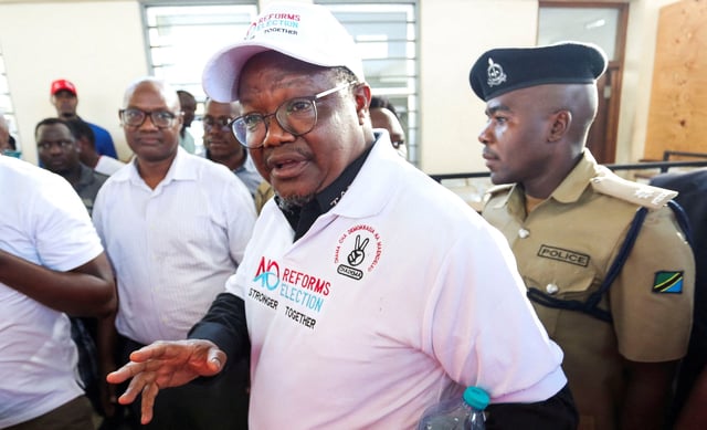 Tanzanian opposition leader and former presidential candidate of CHADEMA party Tundu Lissu is escorted as he walks at the Kisutu Resident Magistrate Court in Dar es Salaam, Tanzania April 10, 2025. REUTERS/Emmanuel Herman/File Photo