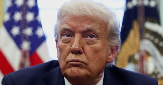 U.S. President Donald Trump looks on on the day he signs executive orders in the Oval Office at the White House in Washington, D.C., U.S., April 17, 2025. REUTERS/Evelyn Hockstein