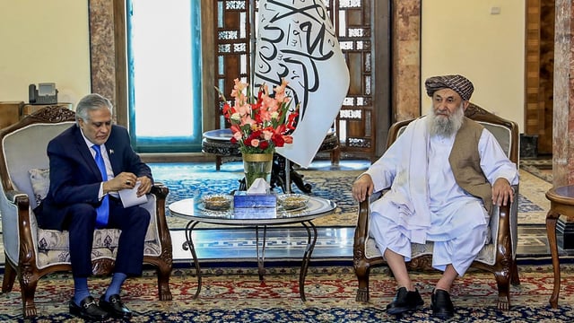 Afghan Prime Minister Hassan Akhund (R) and Pakistan's Foreign Minister Ishaq Dar during a bilateral meeting in Kabul. Dar flew to Kabul for a day-long visit on April 19.