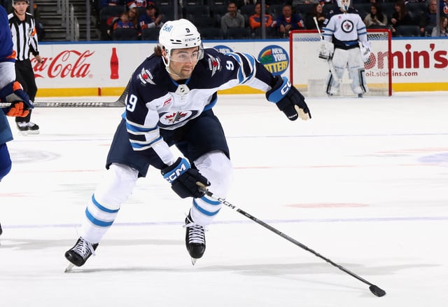 Alex Iafallo #9 of the Winnipeg Jets skates against the New York Islanders at UBS Arena on March 23, 2024 in Elmont, New York.
