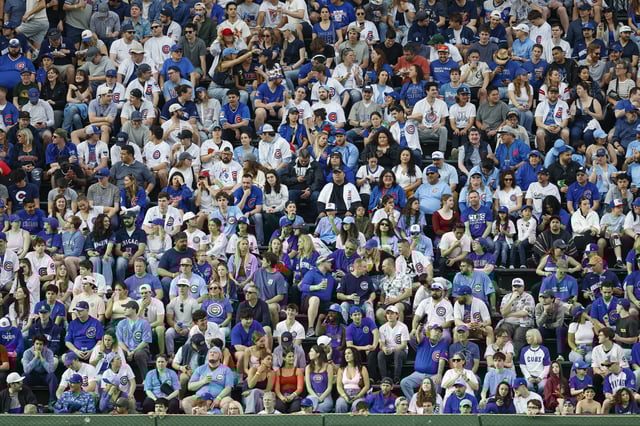 Apr 18, 2025; Chicago, Illinois, USA; Fans watch a game between the Chicago Cubs and Arizona Diamondbacks during the seventh inning at Wrigley Field. Mandatory Credit: Kamil Krzaczynski-Imagn Images/File Photo