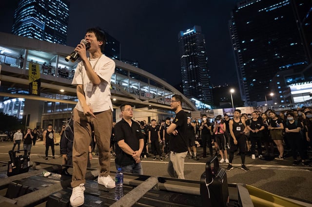 Democratic Party lawmaker Roy Kwong Chun-yu addresses crowds at a protest in Hong Kong on June 16, 2019.