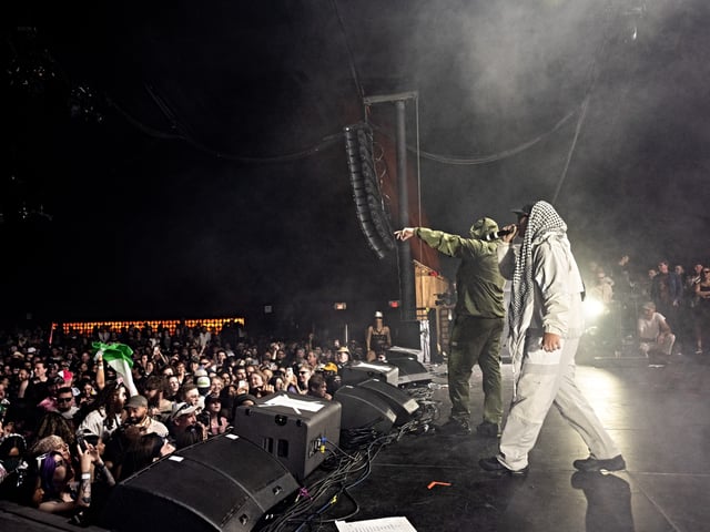 INDIO, CALIFORNIA - APRIL 18: (FOR EDITORIAL USE ONLY) Members of the band Kneecap including Mo Chara and Moglai Bap perform onstage during Day 1 of Coachella Valley Music and Arts Festival on April 18, 2025 in Indio, California. (Photo by Scott Dudelson/Getty Images for Coachella)