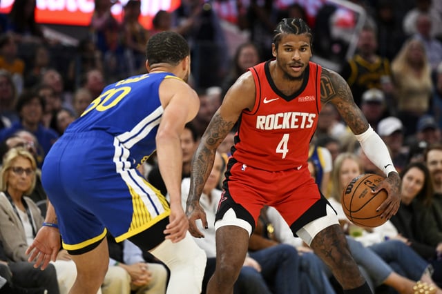 Jalen Green #4 of the Houston Rockets dribbles against Stephen Curry #30 of the Golden State Warriors in the third quarter at Chase Center on April 06, 2025 in San Francisco, California.