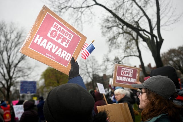 Demonstrators rally on Cambridge Common in a protest organized by the City of Cambridge calling on Harvard leadership to resist federal government interference at the university in Cambridge, Massachusetts, U.S. April 12, 2025.   REUTERS/Nicholas Pfosi/File Photo