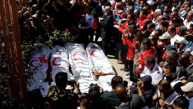 Palestinians mourn medics, who came under Israeli fire while on a rescue mission, after their bodies were recovered, according to the Red Crescent, at Nasser hospital in Khan Younis in the southern Gaza Strip.