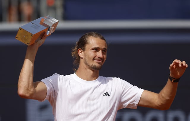 Tennis - ATP 500 - Munich Open - MTTC Iphitos, Munich, Germany - April 20, 2025 Germany's Alexander Zverev celebrates with the trophy after winning the Munich Open REUTERS/Michaela Stache