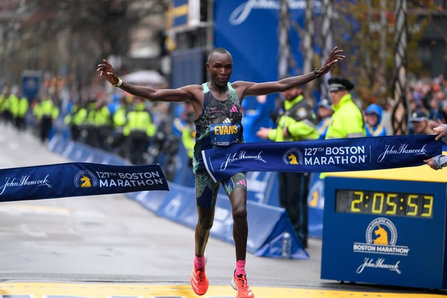 Evans Chebet of Kenya crosses the finish line to win the men's division in the 2023 Boston Marathon.