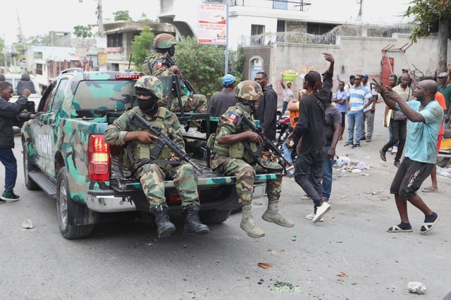 Haitian army soldiers patrol during a protest against insecurity in Port-au-Prince, Haiti, Wednesday, April 16, 2025. (AP Photo/Odelyn Joseph)