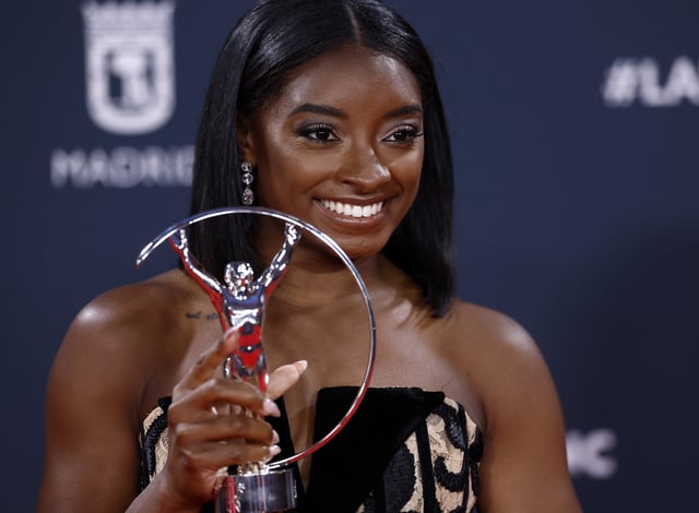 Laureus World Sports Awards - Palacio de Cibeles, Madrid, Spain  - April 21, 2025 United States gymnast Simone Biles poses with the sportswoman of the year award after the ceremony REUTERS/Juan Medina