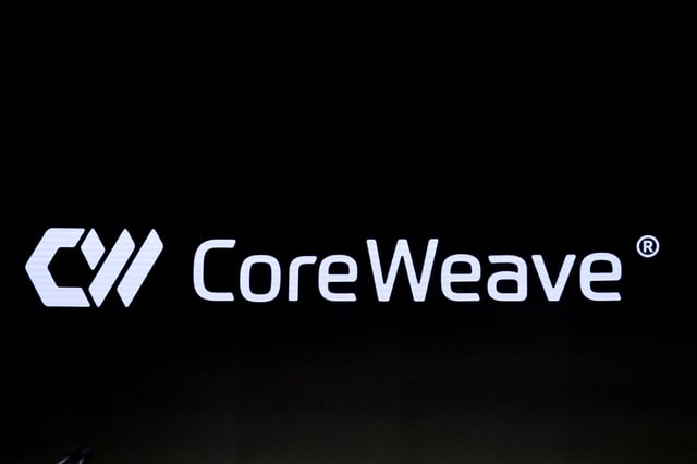 A screen displays the company logo for CoreWeave, Inc., Nvidia-backed cloud services provider, during the company's IPO at the Nasdaq Market, in New York City, U.S., March 28, 2025. REUTERS/Brendan McDermid