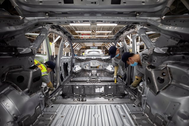 Employees work on an electric vehicle (EV) production line at a Volkswagen Anhui factory in Hefei, Anhui province, China September 25, 2024. China Daily via REUTERS  ATTENTION EDITORS - THIS IMAGE WAS PROVIDED BY A THIRD PARTY. CHINA OUT./File Photo