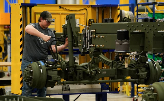 A technician works on a HIMARS (High Mobility Artillery Rocket System) missile launcher chassis at Lockheed Martin Camden Operations in Camden, Arkansas, U.S., February 27, 2023. REUTERS/Kevin Lamarque/File Photo