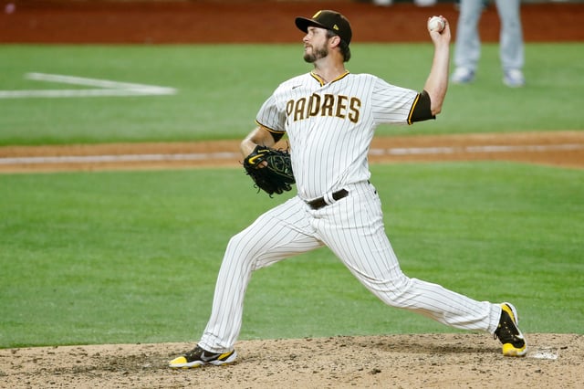 Oct 8, 2020; Arlington, Texas, USA; San Diego Padres relief pitcher Drew Pomeranz (15) pitches against the Los Angeles Dodgers during the eighth inning during game three of the 2020 NLDS at Globe Life Field. The Los Angeles Dodgers won 12-3 to sweep the San Diego Padres. Mandatory Credit: Tim Heitman-USA TODAY Sports/File Photo