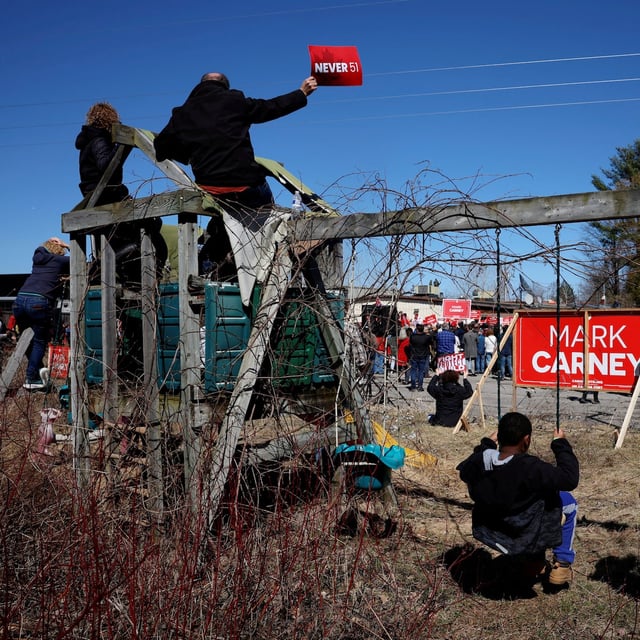 Children sit on swings, as a rally held by Canada's Prime Minister Mark Carney takes place, during his Liberal Party election campaign tour at the Lusitania Portuguese Club of Ottawa in Nepean, Ontario, Canada April 20, 2025. REUTERS/Carlos Osorio     TPX IMAGES OF THE DAY