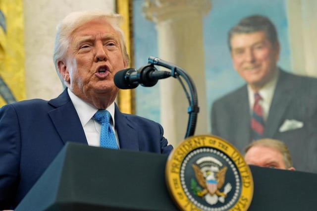 President Donald Trump speaks with reporters as he participates in a ceremonial swearing in of Paul Atkins as chairman of the Securities and Exchange Commission, in the Oval Office of the White House, Tuesday, April 22, 2025, in Washington. (AP Photo/Alex Brandon)