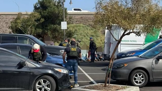 Immigration officers detain day laborers outside a Home Depot in Pomona on Tuesday, April 22, 2025.