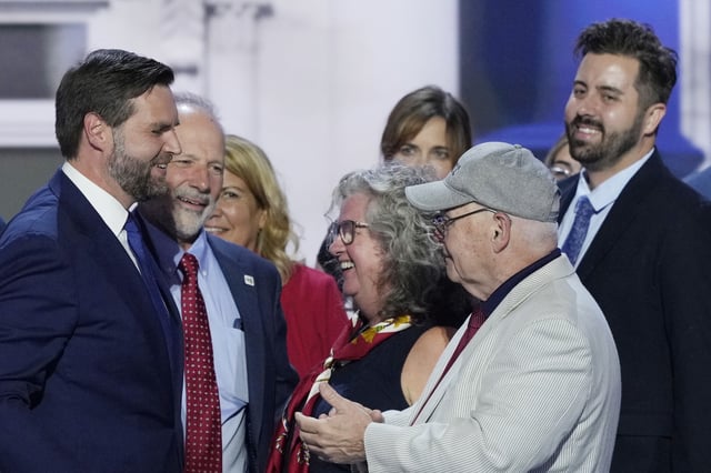 Cory Bowman, half-brother of Republican vice presidential candidate Sen. JD Vance, R-Ohio, top right, is pictured on stage with Vance, left, during the Republican National Convention, Wednesday, July 17, 2024, in Milwaukee. (AP Photo/J. Scott Applewhite)