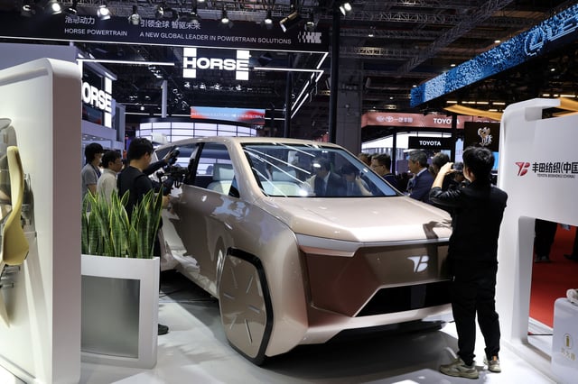 People look at Toyota Boshoku's MX OASIS concept car during a media day for the Auto Shanghai show in Shanghai, China April 23, 2025. REUTERS/Go Nakamura