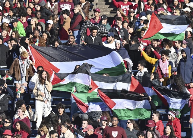 NEW HAVEN, CT - NOVEMBER 18: Harvard Crimson students protests for Palestine during the game as the Harvard Crimson take on the Yale Bulldogs on November 18, 2023 at the Yale Bowl, Class of 1954 Field in New Haven, CT (Photo by Williams Paul/Icon Sportswire) (Icon Sportswire via AP Images)