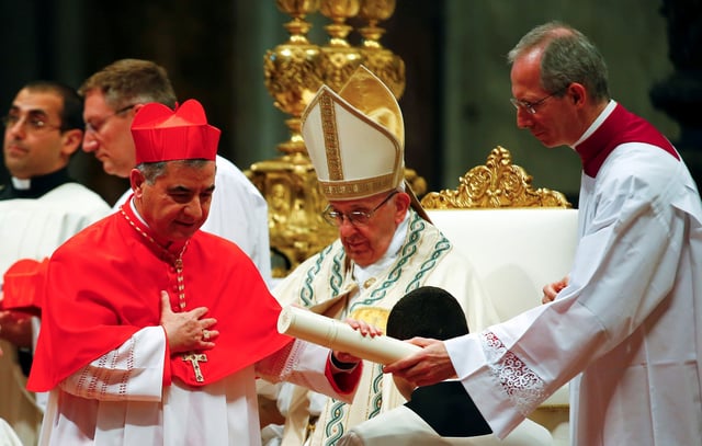 Cardinal Giovanni Angelo Becciu (left) pictured in St. Peter's Basilica at the Vatican, in June 2018.
