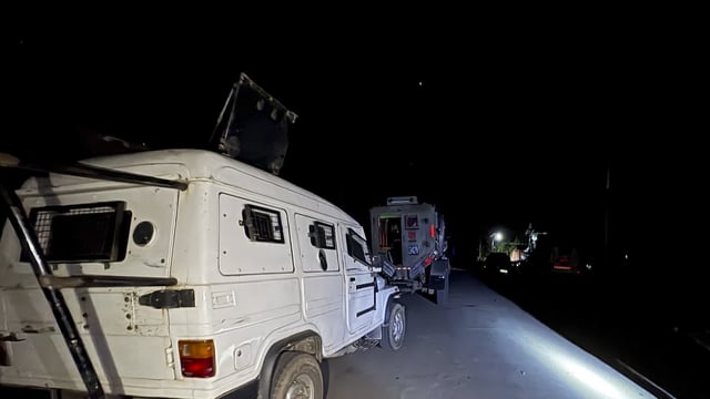 Security vehicles stationed during a cordon and search operation after a gunfight broke out between terrorists and security forces, in Kulgam district of Jammu and Kashmir, Wednesday, April 23, 2025. 