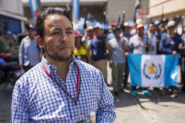 FILE - Luis Pacheco, President of the K'iche' Indigenous organization "48 Cantones de Totonicapan," poses for photos with Mayors, who are members of the organization, outside the Attorney General's headquarters in Guatemala City, Oct. 11, 2023. The "48 Cantones de Totonicapán" is an Indigenous organization that has been leading the national protests asking for the resignation of Guatemala's Attorney General Consuelo Porras for her attempts to invalidate the recent presidential election. (AP Photo/Moises Castillo, File)