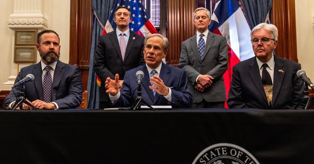 Flanked by House Speaker Dustin Burrows and Lt. Gov. Dan Patrick, Gov. Greg Abbott signs his first bill into law this session on April 23, 2025. Senate bill 14 establishes a DOGE office in state government. Looking on from behind are the bill's sponsor, state Rep. Giovanni Capriglione, R-Southlake, and its author, state Sen. Phil King, R-Weatherford.
