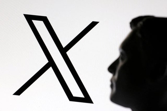 A 3D-printed miniature model of Elon Musk and the X logo are seen in this illustration taken January 23, 2025. REUTERS/Dado Ruvic/Illustration/File Photo