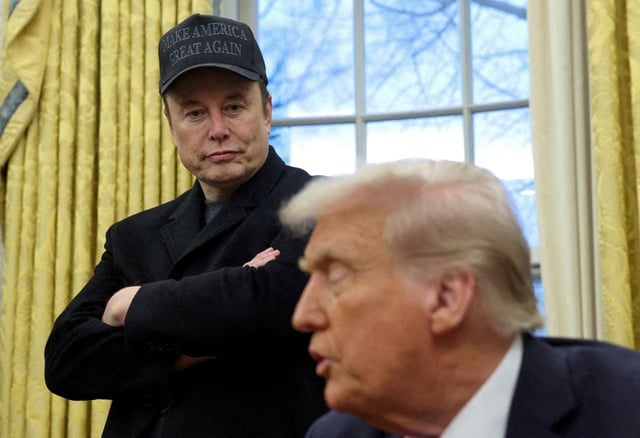 Elon Musk listens to U.S. President Donald Trump speak in the Oval Office of the White House in Washington, D.C., U.S., February 11, 2025.   REUTERS/Kevin Lamarque/File Photo