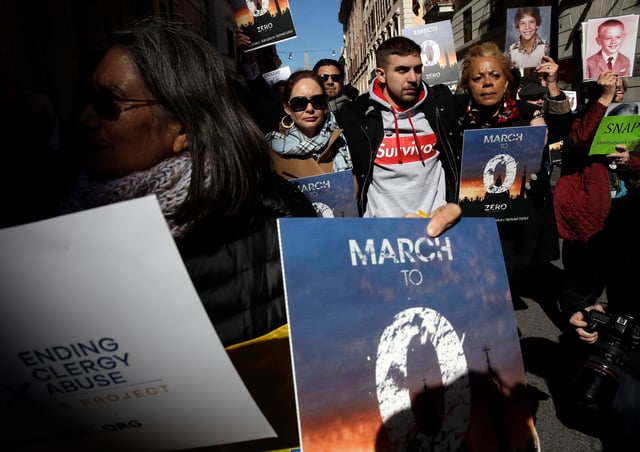 Sex abuse survivor Alessandro Battaglia, center, marches alongside other survivors and advocates in Rome in February 2019 as Pope Francis hosts a four-day summit on preventing clergy sexual abuse.