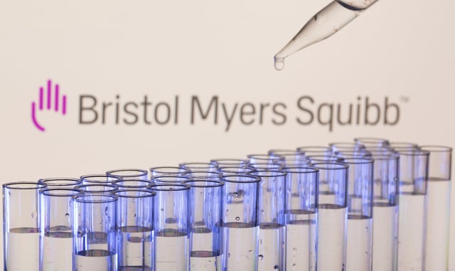 Test tubes are seen in front of a displayed Bristol Myers Squibb logo in this illustration taken, May 21, 2021. REUTERS/Dado Ruvic/Illustration