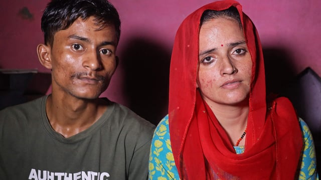 Sachin Meena (L) and Seema Haider attend an interview with AFP at their residence in Greater Noida. 