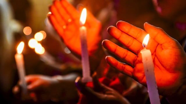 People hold a candlelight vigil to pay tribute to the victims of terrorist attack in J&K's Pahalgam, in Kolkata, Thursday, April 24, 2025. 