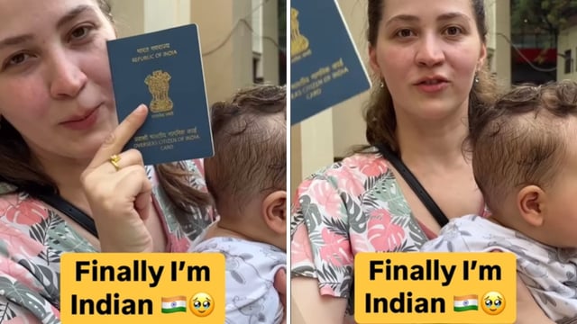 A woman showing her OCI passport. 