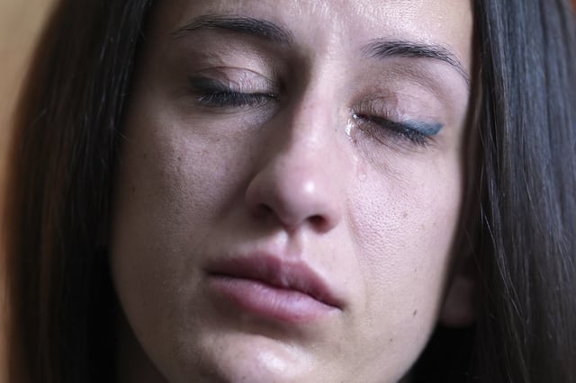 Oksana Tarasiuk cries as she talks about her husband, Maksym Chernyak, who died in ICE custody after being held in Krome Detention Center, at the couple's apartment in Hallandale Beach, Fla., Tuesday, April 22, 2025. (AP Photo/Rebecca Blackwell)