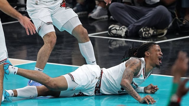 Ja Morant #12 of the Memphis Grizzlies reacts after falling to the court during the first half against the Oklahoma City Thunder 