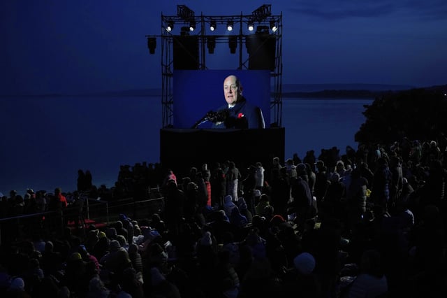 People watch as New Zealand Prime Minister Christopher Luxon delivers a speech during the "Spirit of Place" ceremony and dawn service at Anzac Cove beach, the site of the April 25, 1915, World War I landing of the ANZAC (Australian and New Zealand Army Corps), on the Gallipoli Peninsula near Canakkale, Turkey, early Friday, April 25, 2025. (AP Photo/Emrah Gurel)