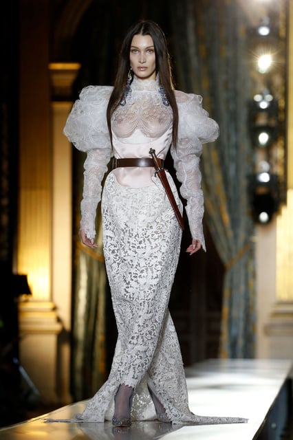 Model Bella Hadid wore a lace wedding dress as she walked the Vivienne Westwood fall-winter 2020 runway at Paris Fashion Week.