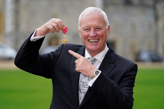Barry Hearn poses for a photo after he received his Officer of the Most Excellent Order of the British Empire (OBE) medal from Britain's Charles, Prince of Wales, during an investiture ceremony at Windsor Castle in Windsor, Britain, December 15, 2021. Andrew Matthews/Pool via REUTERS/File Photo