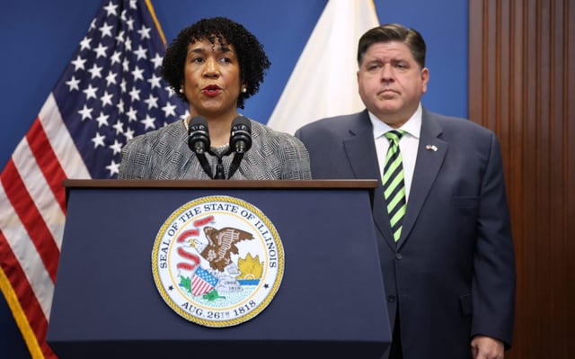 Illinois Lt. Gov. Juliana Stratton speaks during a news conference on Jan. 28, 2025, about the impact of President Donald Trump’s order to freeze trillions of dollars in federal grants and loans. Illinois Gov. JB Pritzker is at right. (Terrence Antonio James/Chicago Tribune)