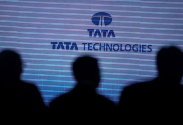 People are pictured with the background of  Tata Technologies logo during a press conference in Mumbai, India, October 8, 2024. REUTERS/Francis Mascarenhas/ File Photo