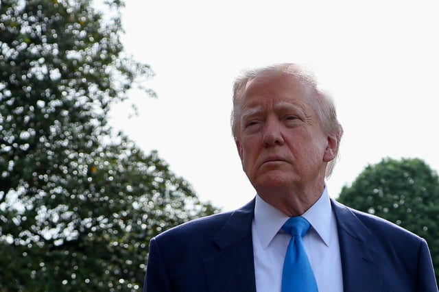 U.S. President Donald Trump speaks to members of the media as he departs for Rome, Italy, to attend Pope Francis' funeral, at the White House in Washington, D.C., U.S., April 25, 2025. REUTERS/Leah Millis
