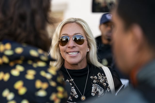 Marjorie Taylor Greene speaks to reporters while arriving at the Capitol Hill Club for a meeting of the House Republican Conference on March 25, 2025 in Washington, D.C.