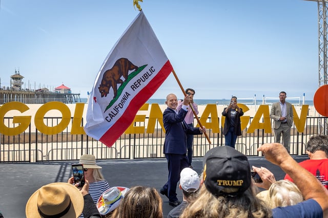 FILE: Supporters cheer as conservative commentator Steve Hilton waves the California state flag as he announces his campaign for California governor at the Pier Plaza in Huntington Beach, Calif., Tuesday, April 22, 2025. 